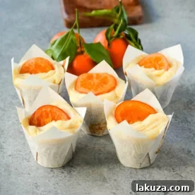 Moist orange olive oil cupcakes that are light, tender, and bursting with fresh orange flavor, finished with orange cream cheese frosting.