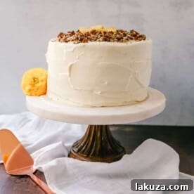 Classic Southern Hummingbird Cake with pineapple, bananas, pecans, and sweet cream cheese frosting.