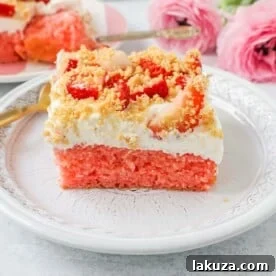 Strawberry Cream Crunch Cake with sweetened condensed milk, whipped cream, fresh strawberries, and crushed golden Oreos.