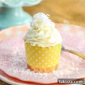 Moist coconut cupcakes with a secret ingredient for extra softness, topped with sweet coconut cream cheese frosting.
