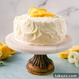 The best moist, light, and fluffy lemon cake made with fresh lemon juice, layered with lemon curd and lemon cream cheese frosting.