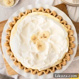 Indulge in the sweet and creamy goodness of this classic Banana Cream Pie, made with a buttery crust, smooth vanilla custard, fresh bananas, and fluffy whipped cream.