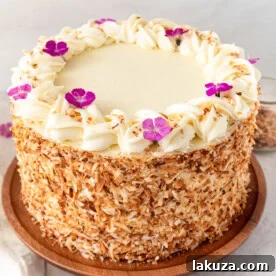 Moist coconut cake with coconut cream cheese frosting.