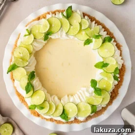 The best key lime pie with a sweet and buttery graham cracker crust, tangy key lime juice filling, and whipped cream topping.