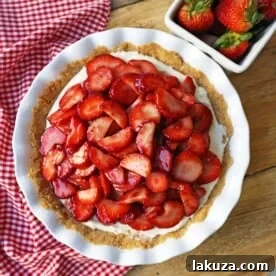 Strawberry Cream Cheese Pie with a sweet cream cheese filling, buttery graham cracker crust, and glazed strawberries.