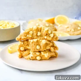 Soft, thick, chewy, bakery-style Levain Bakery Lemon Cookies with three types of lemon flavoring and lemon chips.