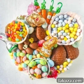 A beautiful Easter Candy Charcuterie Board featuring colorful and sweet Easter candies and decadent chocolates.