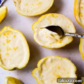 Silky, smooth lemon custard served in fresh lemons, a simple yet elegant quick and easy lemon dessert.