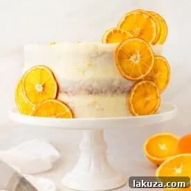 A moist, tender fresh orange cake with a sweet orange cream cheese frosting, bursting with bright citrus flavor.