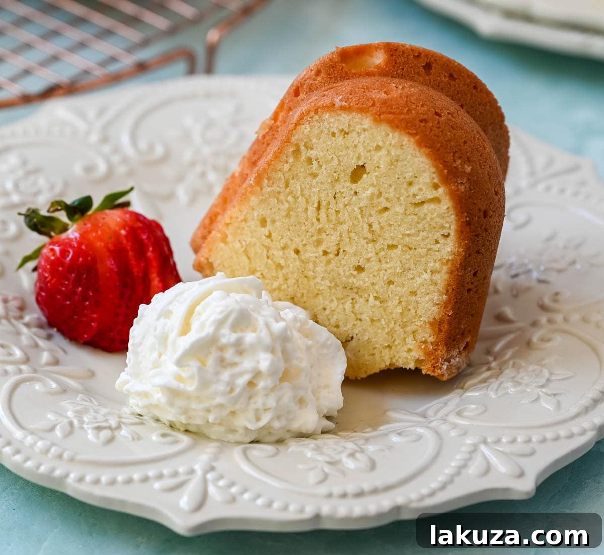 A beautifully golden-brown classic sour cream pound cake, showcasing its moist and tender crumb, perfect for any occasion.