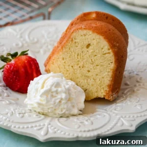 A slice of classic sour cream pound cake, rich and moist, with a perfect tender crumb.