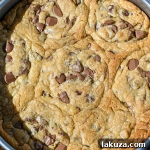 Scoopable chocolate chip cookie in a pan.