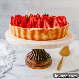 Delicious Strawberry Recipes for Every Occasion 7 Strawberry cream cheese tart with a buttery crust, vanilla filling, and glazed strawberries.