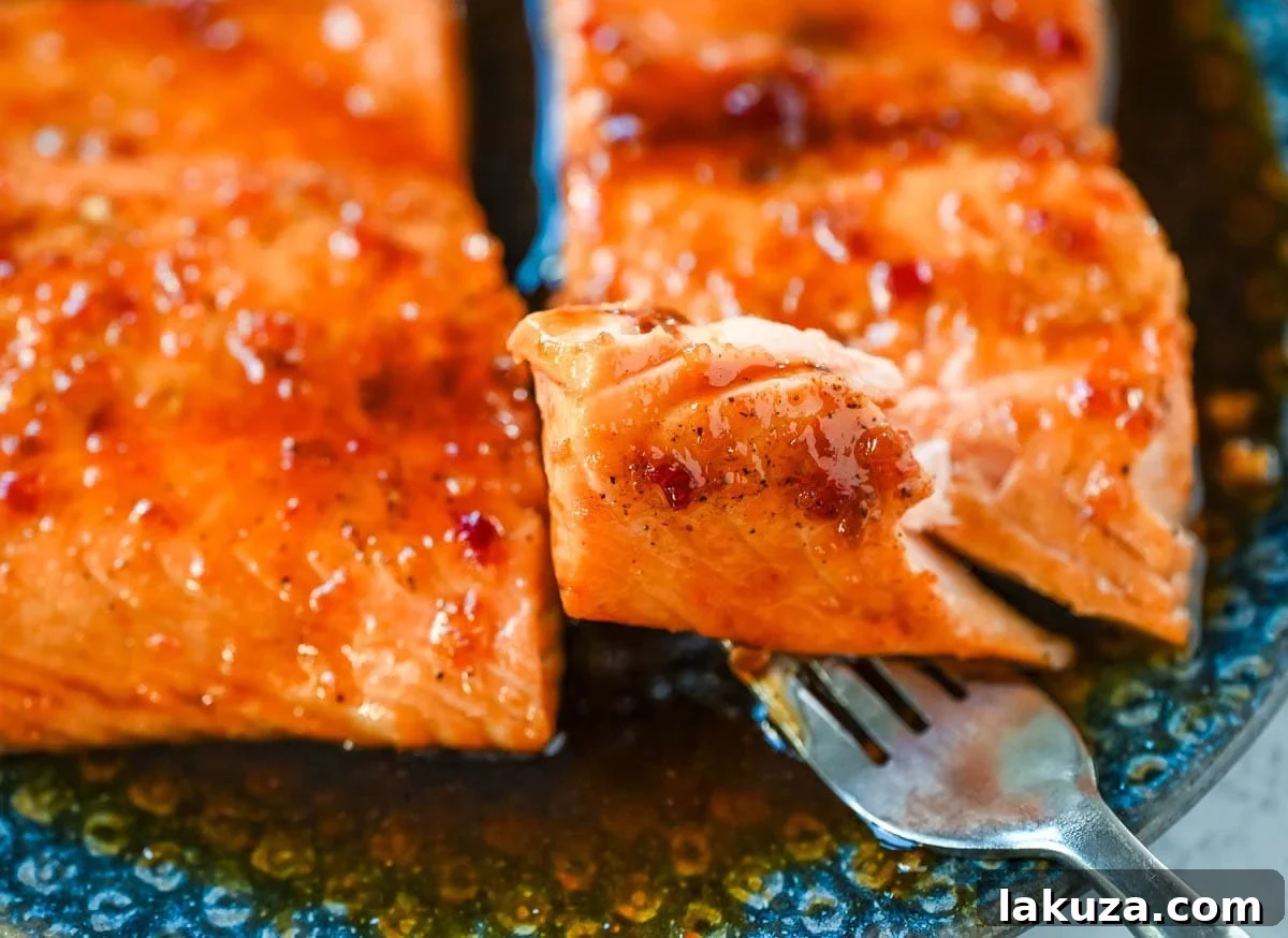 Sticky Honey Garlic Salmon Recipe for Quick Weeknight Dinner 5 Flaky honey garlic salmon on a plate