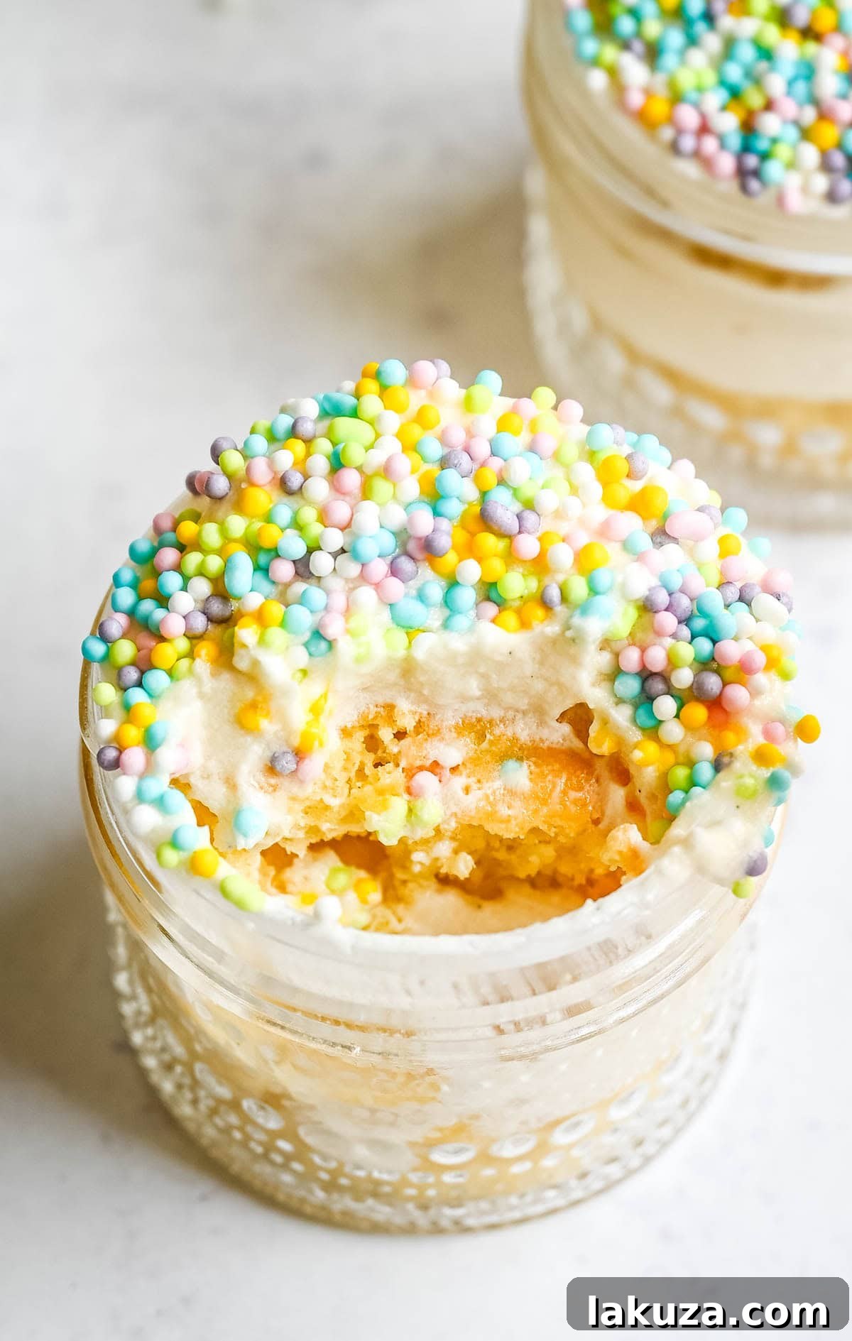 Jarred Dot Cake Recipe: Layered Mini Cakes in a Jar 3 Dot Cake Recipe (Cake in a jar). This viral dot cake recipe brings the NYC sprinkle cake trend straight to your kitchen — no trip to Butterfield Market required! Soft, buttery homemade yellow cake layered in a cup, topped with creamy vanilla buttercream, and completely coated in rainbow nonpareil sprinkles for that irresistible crunch. This easy homemade version is better than any boxed mix recipe you'll find — and takes less than an hour to make!