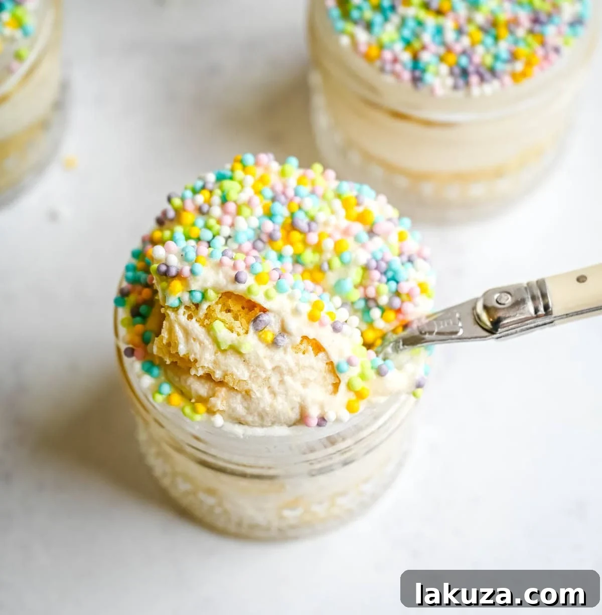 Jarred Dot Cake Recipe: Layered Mini Cakes in a Jar 5 Dot Cake Recipe (Cake in a jar). This viral dot cake recipe brings the NYC sprinkle cake trend straight to your kitchen — no trip to Butterfield Market required! Soft, buttery homemade yellow cake layered in a cup, topped with creamy vanilla buttercream, and completely coated in rainbow nonpareil sprinkles for that irresistible crunch. This easy homemade version is better than any boxed mix recipe you'll find — and takes less than an hour to make!