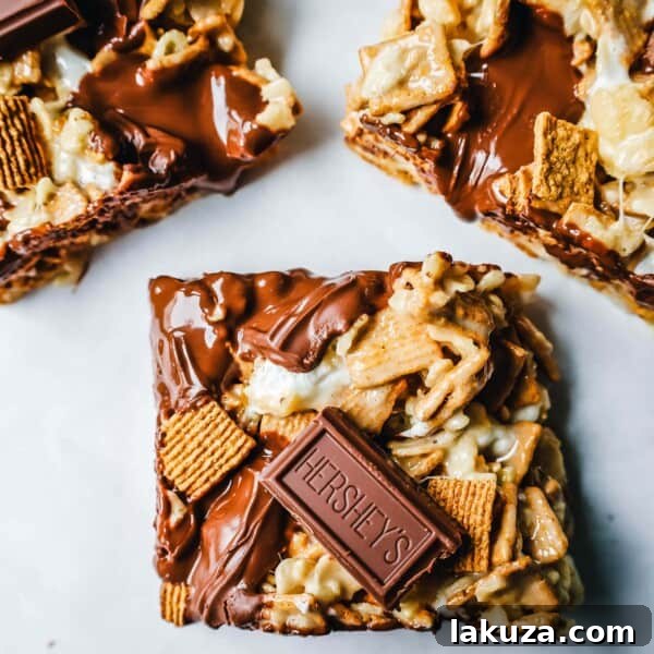 S'more Rice Krispie Treats made with Golden Graham, Rice Krispies, Marshmallows, Butter, and Hershey's Milk Chocolate Bars.