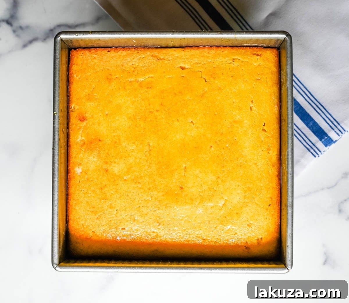 This moist and fluffy hot honey cornbread is sweet, slightly spicy, and absolutely packed with flavor from the very first bite!  This is the most irresistible cornbread topped with hot honey butter you will ever make, and it comes together in just one bowl in under 30 minutes, making it the easiest and most flavorful side dish.