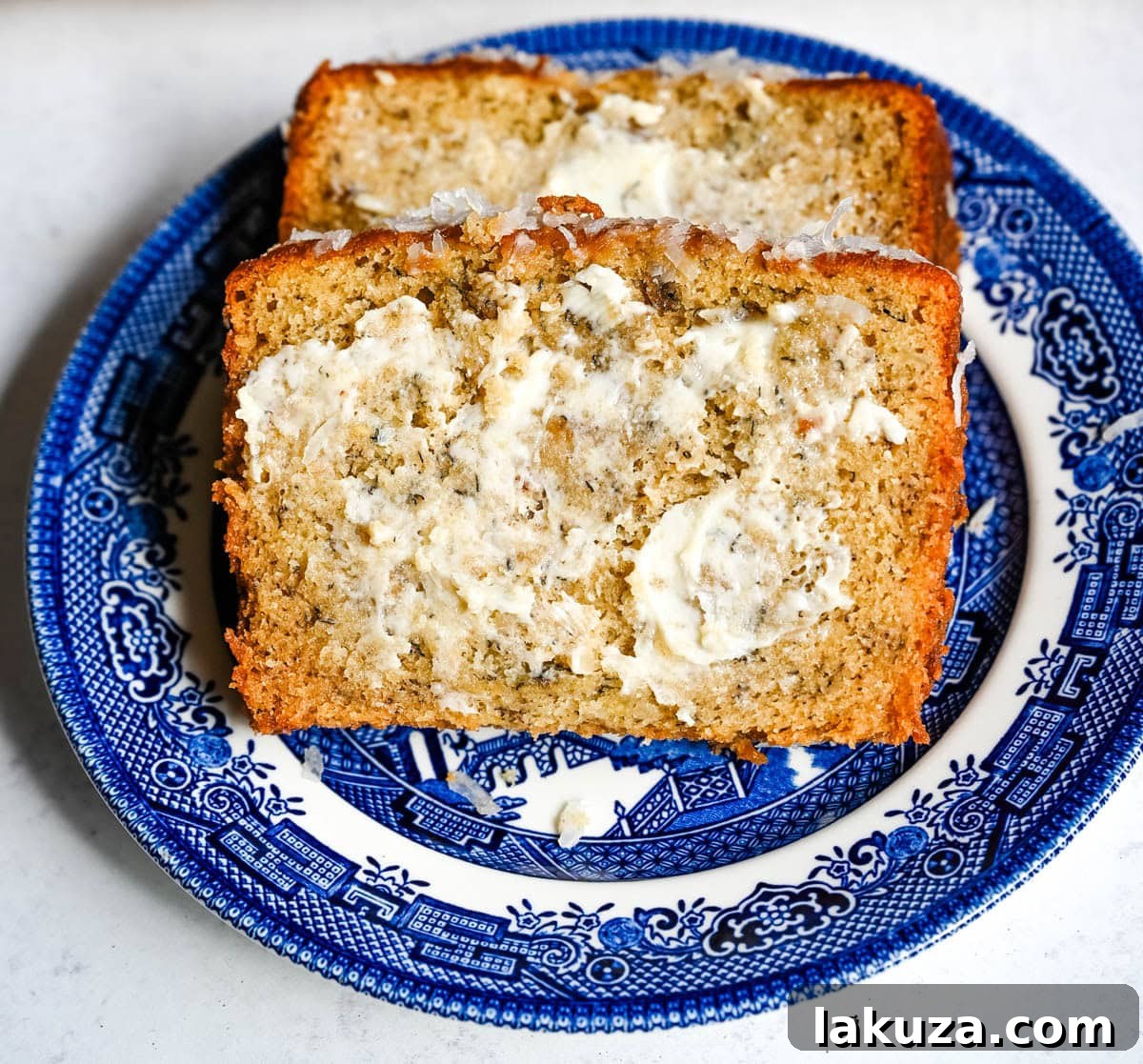 Loaf of banana nut bread on a cutting board.