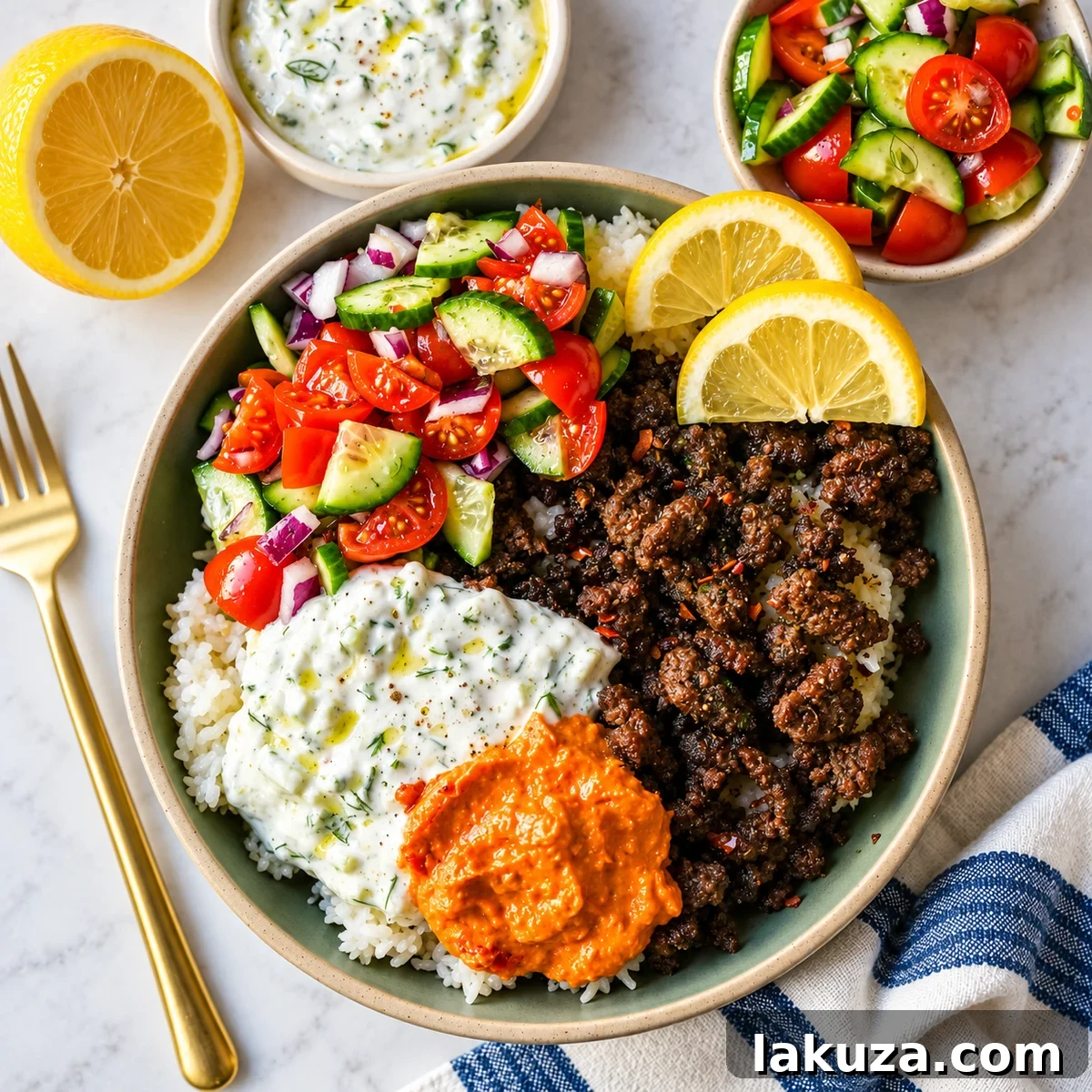 Greek Beef Bowls with Tzatziki, Feta and Lemon Rice 5 Greek Beef Bowls. Juicy seasoned ground beef, bright lemon rice, feta, cucumbers, tomatoes and tzatziki in one easy 35-minute dinner. High-protein bowls that hold up all week for lunches.